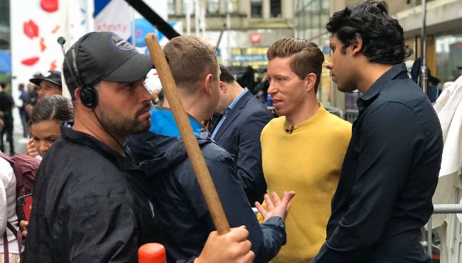 Shaun White talking with man with studio crew nearby